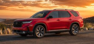 Full exterior view of the 2026 Honda Pilot Refresh in a modern US setting