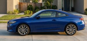 Full exterior view of the 2026 Honda Prelude Hybrid in a modern American environment