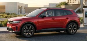 Full exterior view of the 2026 Honda Prologue in a modern American EV setting