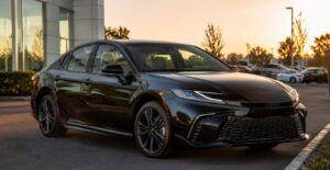 2026 Toyota Camry Hybrid front view in premium glossy black color
